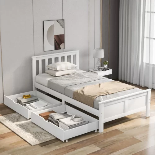 Cama sommier branca com gavetas de arrumação abertas