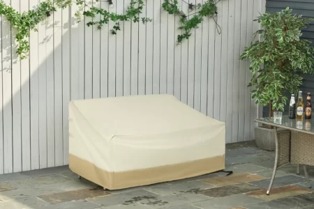 Funda beige impermeable para sofá de jardín de 2 plazas en una terraza